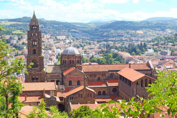 The Cathedral Notre-Dame-de-l'Annonciation du Puy-en-Velay is a major monument of Romanesque art and the Christian West in the Auvergne region, in the center of France The Cathedral Notre-Dame-de-l'Annonciation du Puy-en-Velay is a major monument of Romanesque art and the Christian West in the Auvergne region, in the center of France cardinal clergy stock pictures, royalty-free photos & images