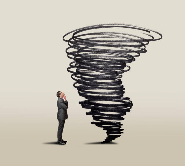istock Businessman Looking Up At Swirling Tornado 1177488962