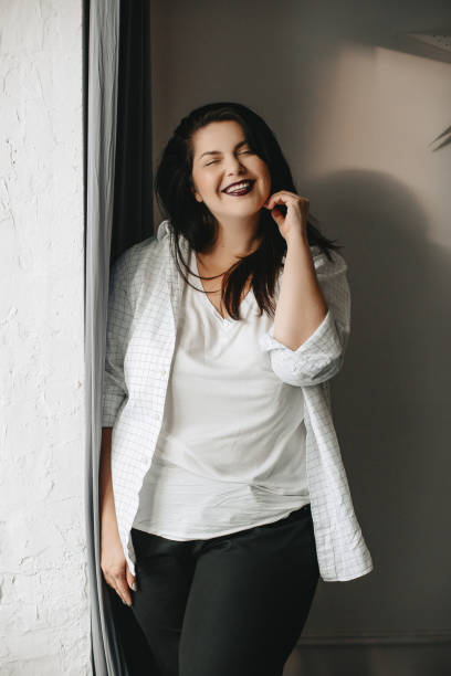 istock Beautiful plus size body positive brunette girl model in studio 1177490702