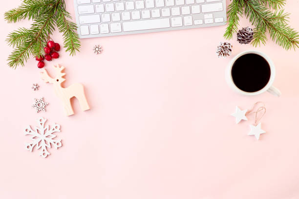 istock Flat lay christmas home office desk with spruce branche and keyboard, christmas decorations on a color background 1177490876