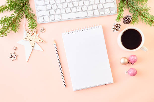 istock Mockup white notebook with spruce branche and keyboard, christmas decorations on a color background 1177490994