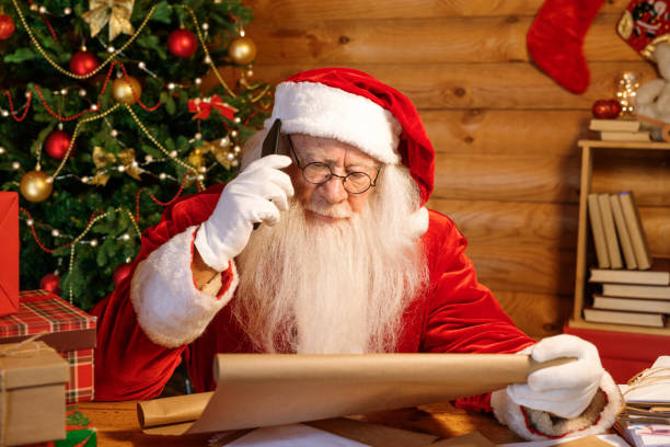 istock Mobile Santa with cellphone calling parents before Christmas 1177491852