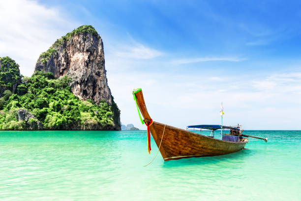 Thai traditional wooden longtail boat. Thai traditional wooden longtail boat and beautiful sand Railay Beach in Krabi province in Thailand. Ao Nang, Thailand. koh poda stock pictures, royalty-free photos & images