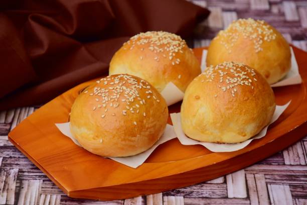 istock Sesame seed bread buns filled with purple sweet potato puree 1177495546