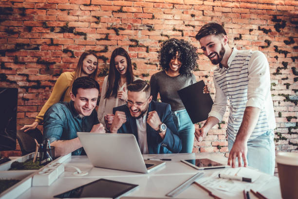 istock Group of multiracial office workers in casual clothes talking about tasks and plans. 1177497699