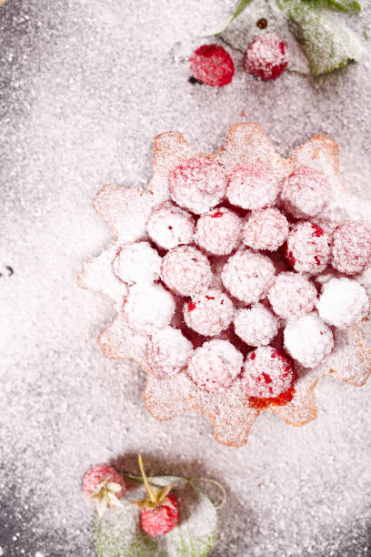 istock muffin decorated with raspberries and completely covered with powdered sugar 1177498190