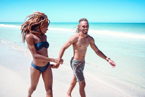 istock Couple Walking On The Beach 1177501282