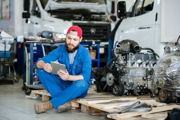 istock Young serious worker or technician in workwear surfing in the net 1177501701