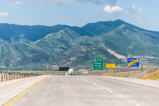 Echo, USA - July 25, 2019: Park City area on interstate 80 highway with road signs for Heber and Provo and mountain view