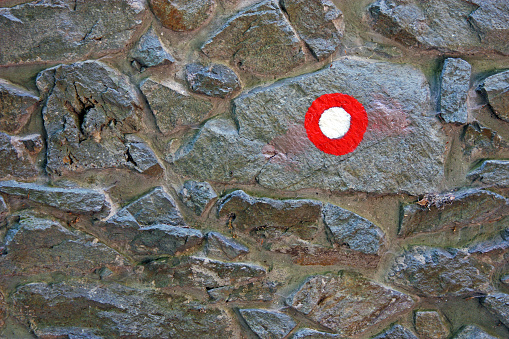 A mountaineering mark on a stone wall, background