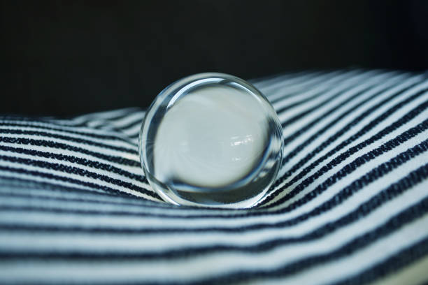 Glass ball on striped fabric