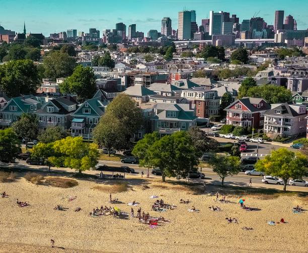 South Boston’s beach goers taking advantage of summers last beach days M st Beach in Southie having an Indian summer massachusetts photos stock pictures, royalty-free photos & images