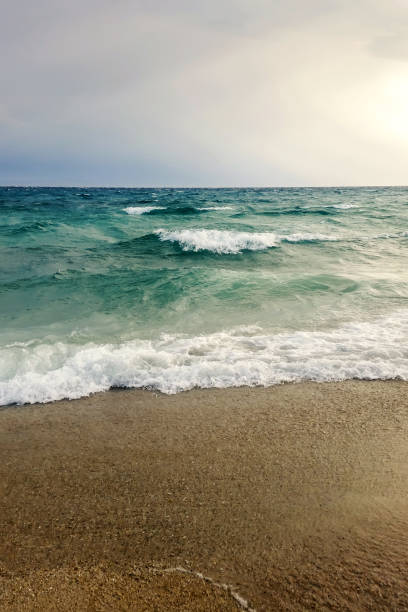 istock Strong waves crash over the beach Beautiful seascape. 1177514573