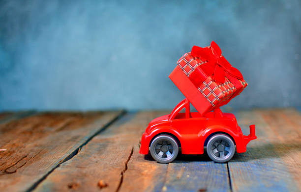 istock Gift and surprise concept with toy car carrying a gift box 1177514851