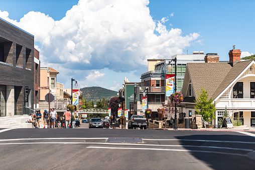 Park City, USA - July 25, 2019: Ski resort famous town street in Utah during summer with downtown colorful historic buildings and cars