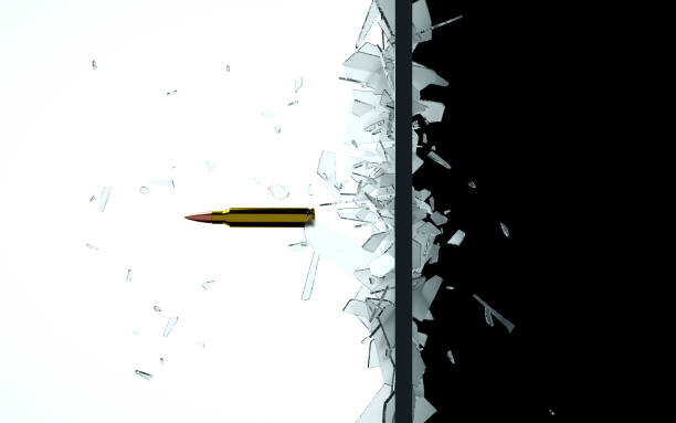 istock Bullet through the shattered glass 1177518860