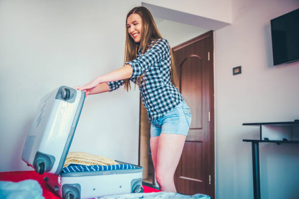 istock Woman packing the suitcase 1177521715