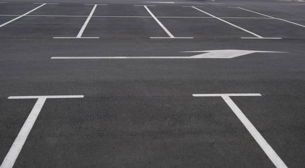 istock View on empty parking with clear markings and arrows indicating the direction. 1177528300