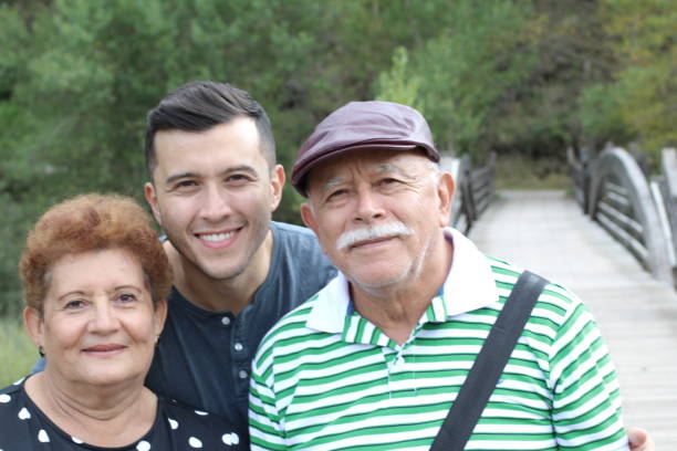 istock Hispanic man with his parents outdoors 1177532181