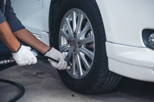 istock man is checking tyre of car 1177534728