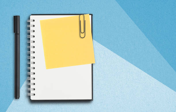 istock office utensils on blue paper background 1177541822