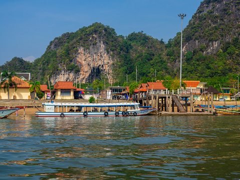 Longtail boat Tour among the scenic limestone islands on March 2017 in Phang Nga Bay. Thailand