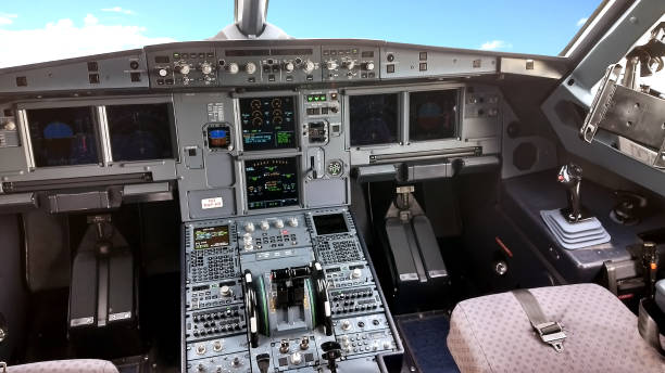 istock Airplane empty cockpit with levers, buttons and screens 1177546570