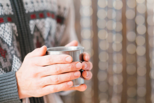 istock winter beverage man hands hot drink steel mug 1177546680