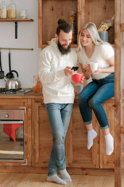 istock morning leisure couple kitchen smartphone fun 1177546681