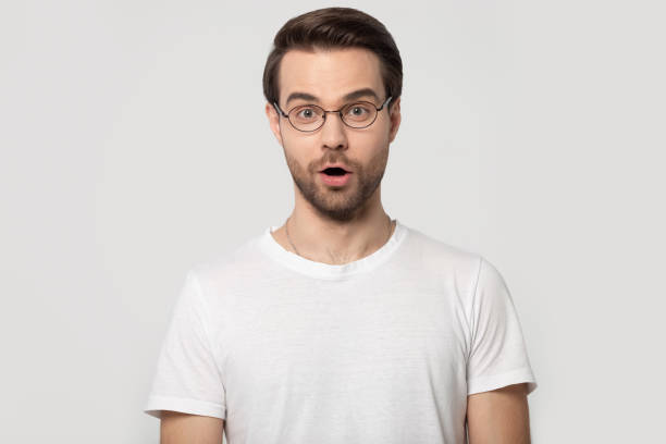 istock Head shot portrait millennial surprised man looking at camera. 1177546750