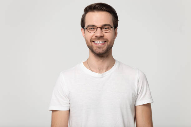 istock Happy smiling millennial guy wearing glasses head shot studio portrait. 1177546773