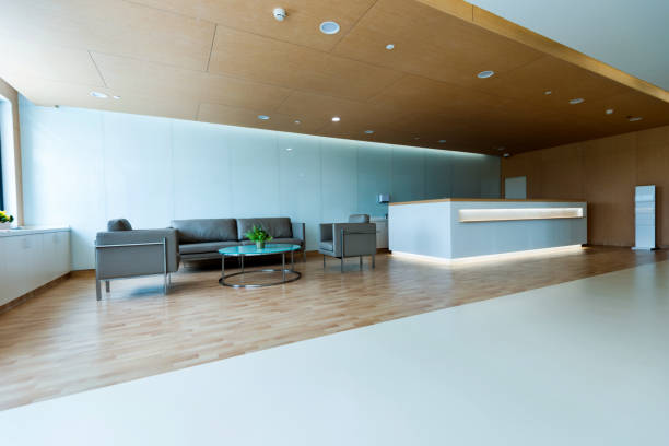 Reception table and armchairs on hospital lobby.