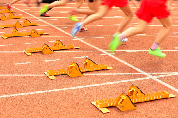 istock sprint start in track and field in blurred motion 1177553937