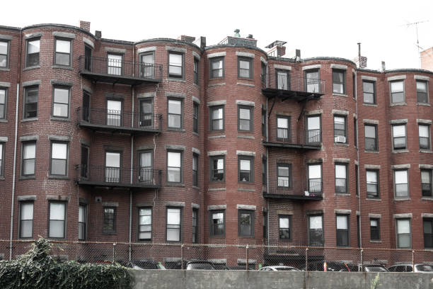 istock Run down old brick urban housing block, brick brownstone 1177556369