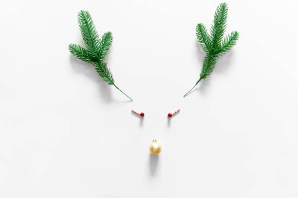 istock Christmas background with reindeer composition, berries and bubble on white background 1177556935