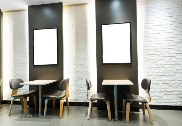 Blank billboard and tables in restaurant