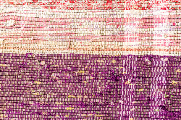 istock Handmade doormat from strips of cloth as background 1177558123
