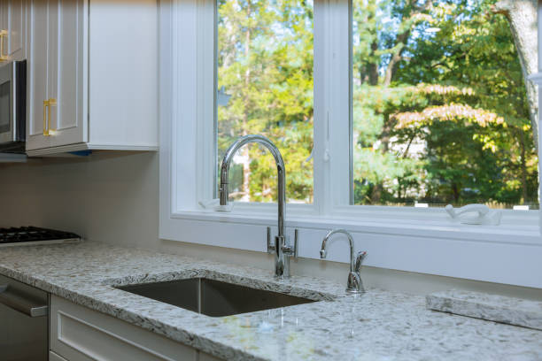 istock Interior of modern kitchen with appliances on stove top, marble counter with kitchen white cabinets 1177561688