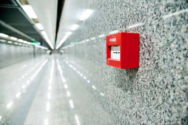 istock Red fire alarm on the wall of corridor 1177561837