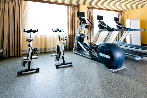 istock Group of exercise machines in gym room 1177565180