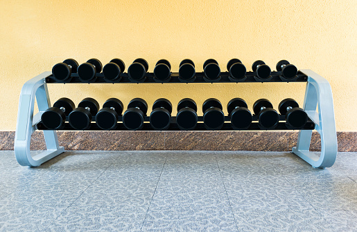 Group of dumbbells on the rack.