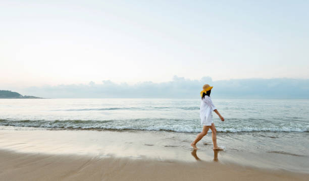 Woman walking on the beach