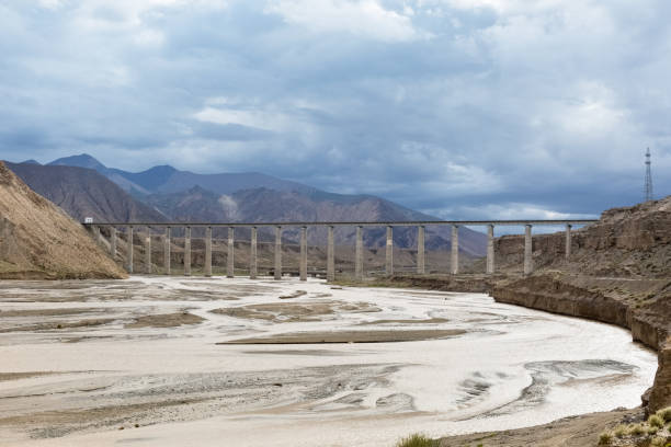 istock railroad bridge on kunlun river and plateau scenery 1177568805