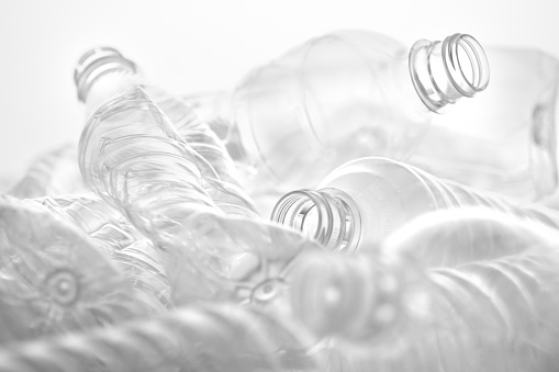 A white and black world where transparent plastic plastic bottles are crushed and overlapped
