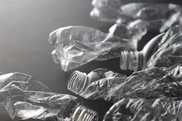 istock Many crushed plastic bottles placed on a black or gray background 1177569688