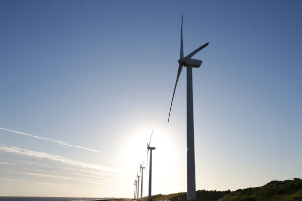 istock Wind generator on blue sky and sunset background 1177571633