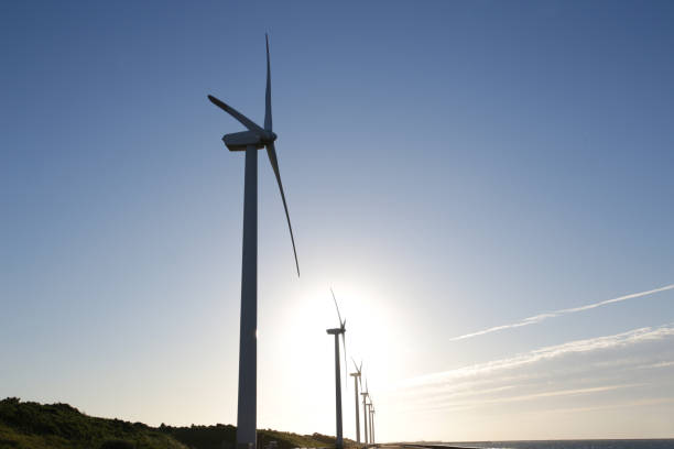 istock Wind generator on blue sky and sunset background 1177571654