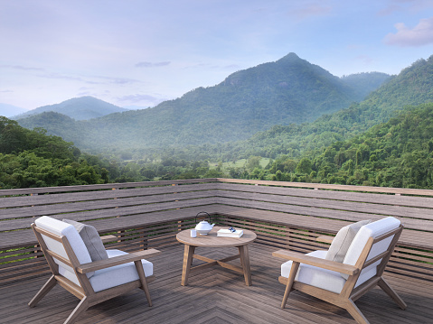 Morning mountain view on a wooden balcony 3d render. There are old wood terrace.Furnished with fabric and wooden furniture. overlooking the surrounding nature view.