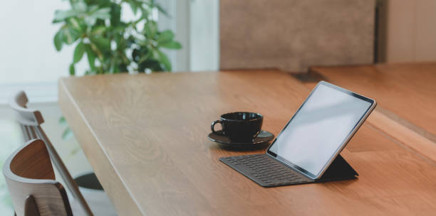 istock Blank screen tablet and a cup of coffee in comfortable workplace 1177574709