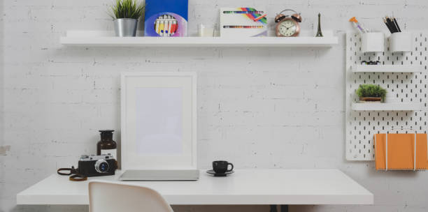 istock Trendy designer workplace with mock up frame and office supplies 1177574773